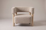 Cingoli chair in Wheat boucle, straight front view: one curved back-and-arm band on four round wood legs