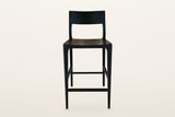 Cison counter stool in Black, straight front view on a warm white studio backdrop
