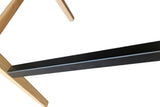 Close-up of the Cison footrest: a flat black metal bar fixed into the ash legs with small screws