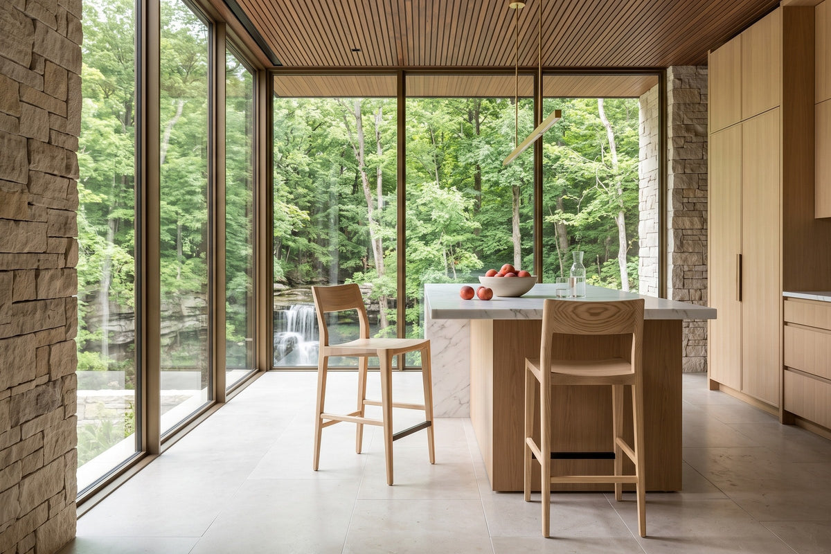 Two Cison counter stools in Natural at a white marble island in an Ancaster house on the Niagara Escarpment