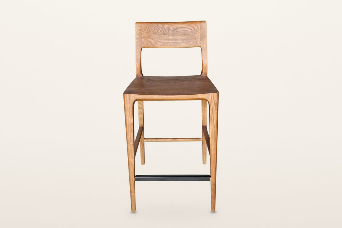 Cison counter stool in Warm Brown, straight front view on a warm white studio backdrop