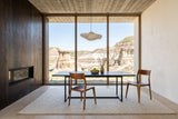 Cison dining chairs in Warm Brown at a soapstone table in a Drumheller house