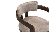 Close-up of the flat espresso arm rail curving round behind the slim light brown boucle back pad of the Cisternino chair