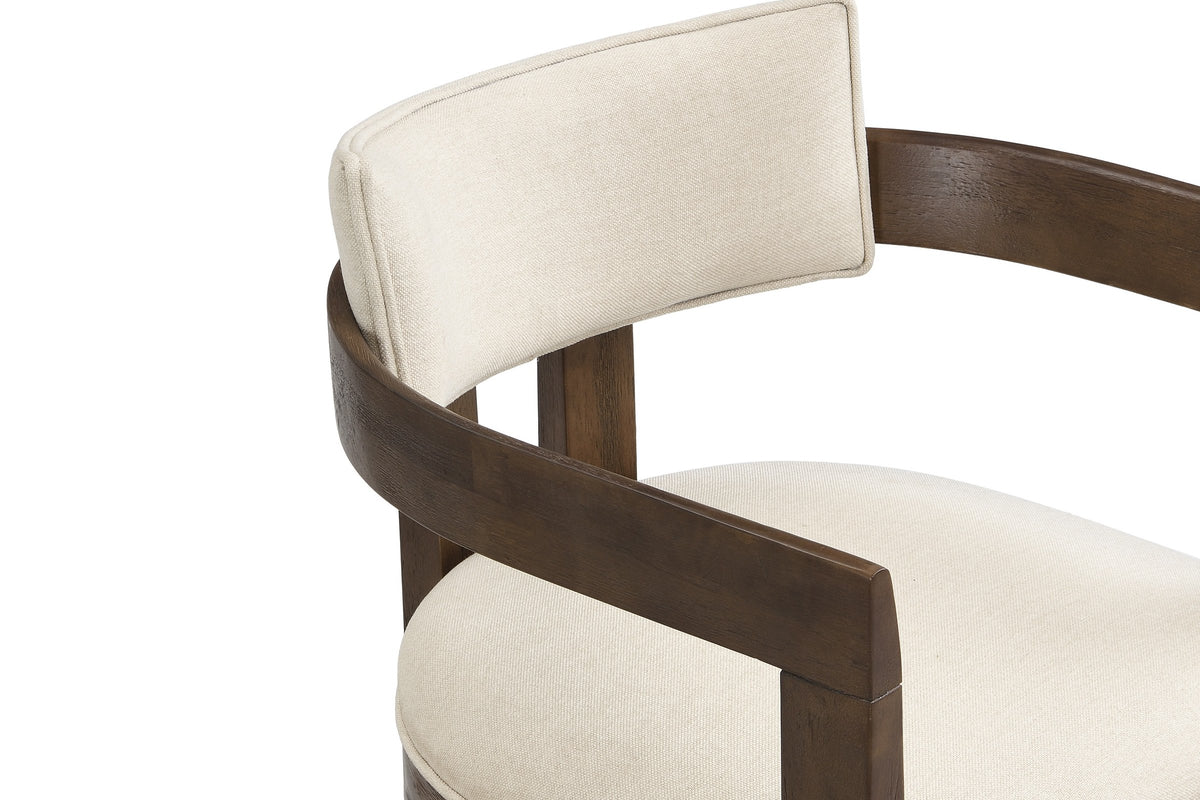 Close-up of the flat walnut arm rail curving round behind the slim beige linen-look back pad of the Cisternino chair