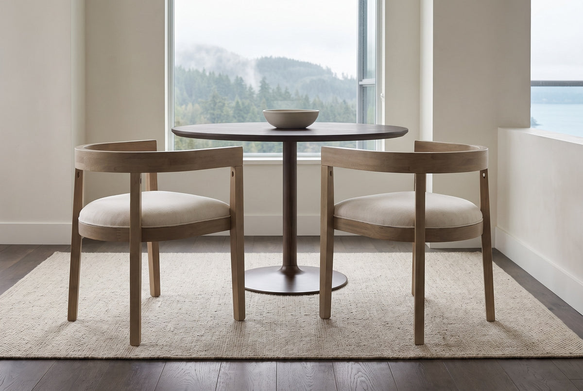 Two Civita dining chairs pulled out from a round smoked-oak pedestal table in a Vancouver condo