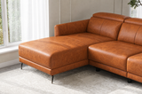 Close-up of the Andria cognac leather chaise, corner seat, and slim black metal legs