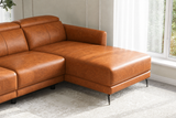Close-up of the Andria cognac leather right-facing chaise, corner seat, and black metal legs