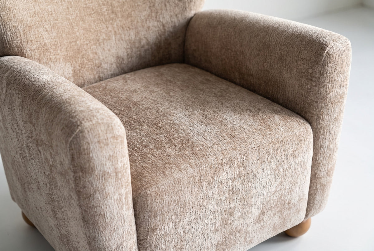 Close-up of the Collodi seat and the inside of the round arms in Beige Brown chenille