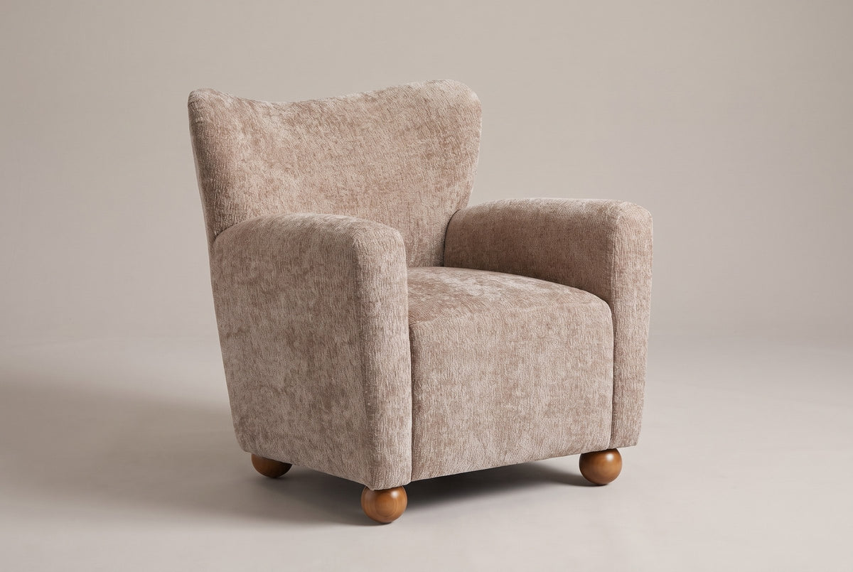 Collodi wingback accent chair in Beige Brown chenille, three-quarter view on a warm grey studio backdrop