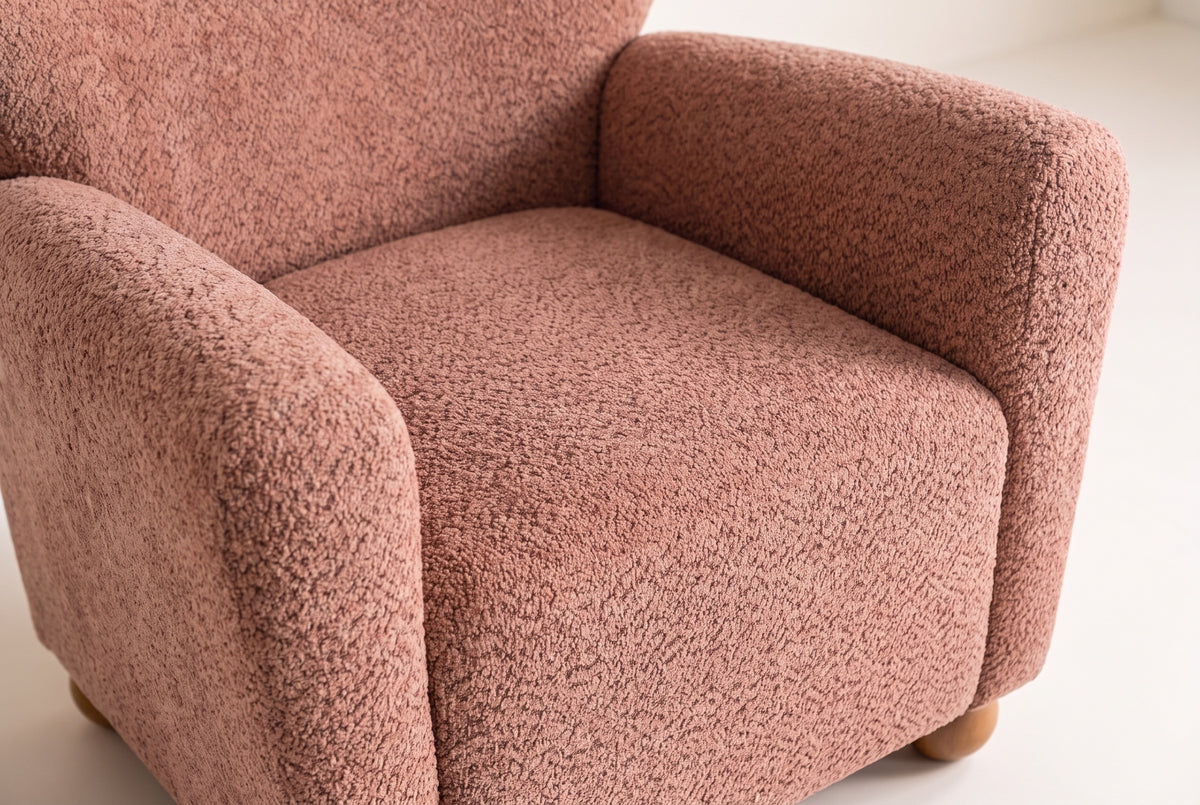 Close-up of the Collodi seat and the inside of the round arms in Coral