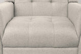 Close-up of the tufted beige seat and lower back, with the sewn tufts and the woven twill fabric