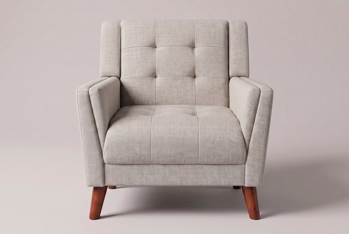 Comacchio armchair in beige, straight front view: tufted back between two upright posts, flared track arms