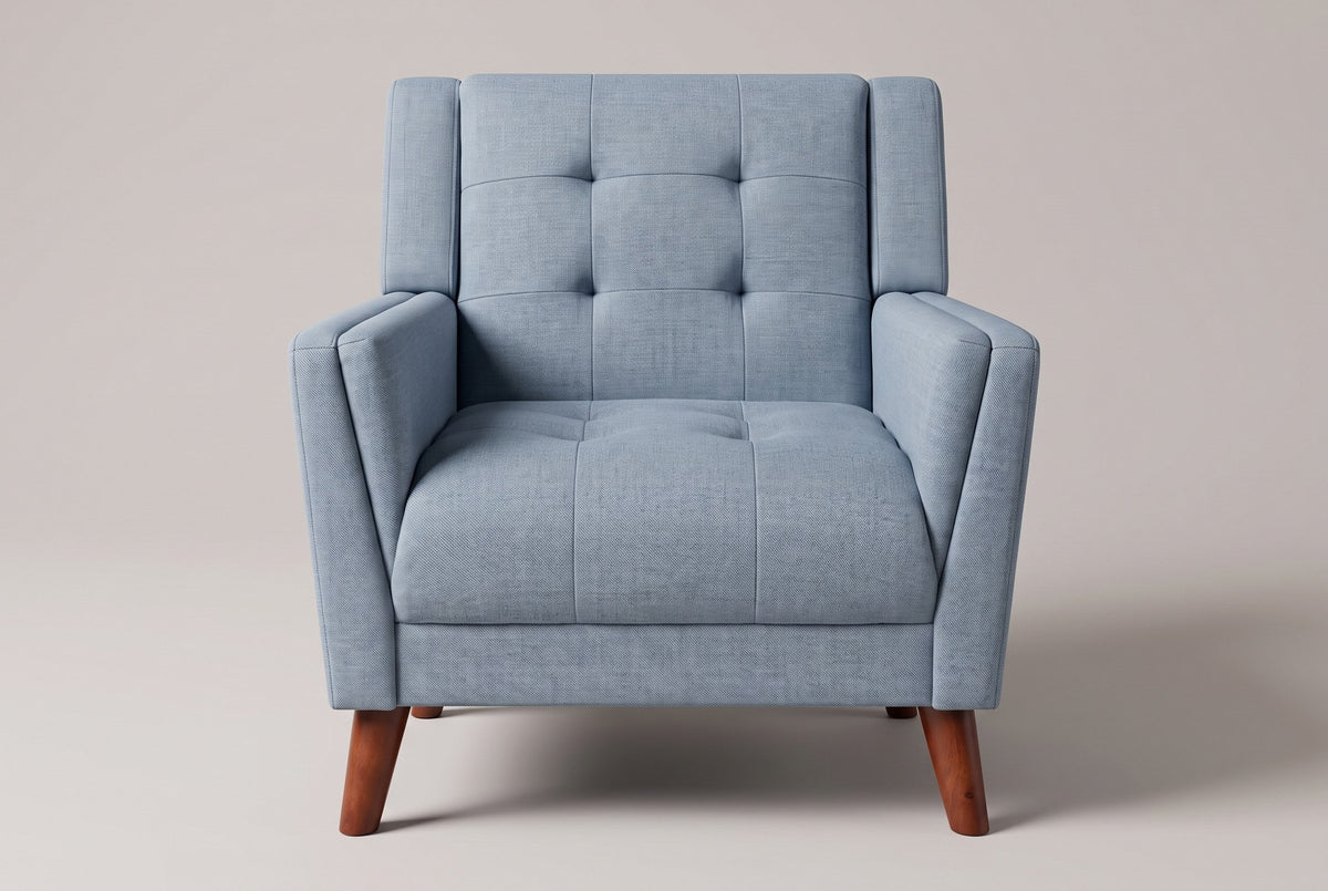 Comacchio armchair in blue, straight front view: tufted back between two upright posts, flared track arms