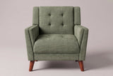 Comacchio armchair in green, straight front view: tufted back between two upright posts, flared track arms