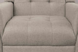 Close-up of the tufted light brown seat and lower back, with the sewn tufts and the woven fabric