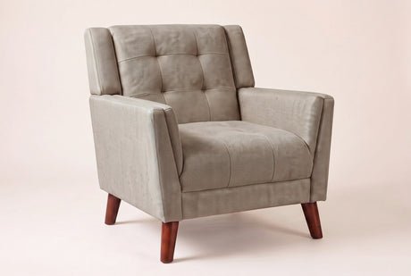 Comacchio tufted mid-century armchair in light brown, three-quarter view on a warm off-white backdrop