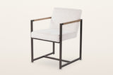 Coreglia dining armchair in White, three-quarter view on a warm white studio backdrop: a looped fabric seat and back in a sli