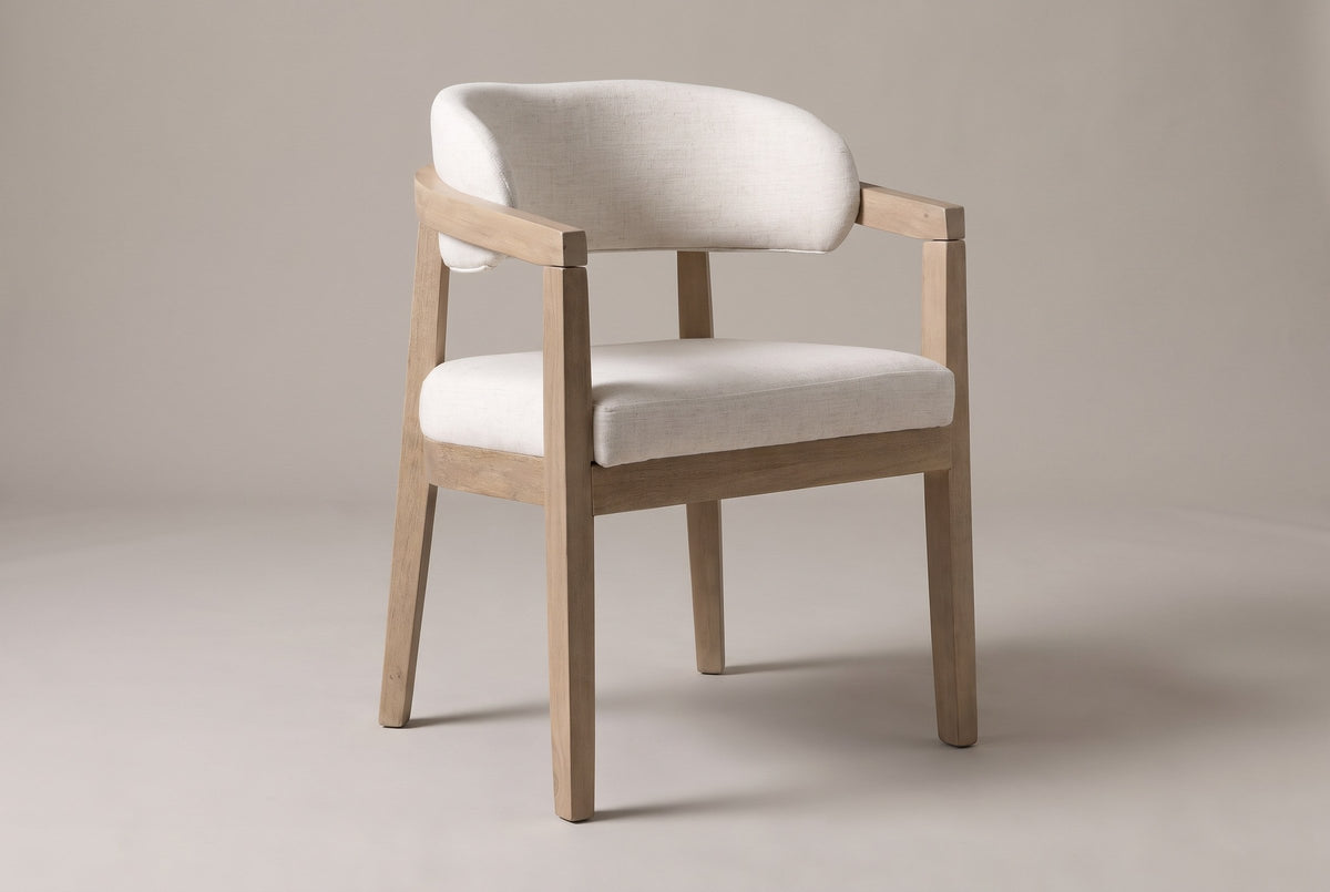 Corinaldo curved-back dining chair in Beige linen-look fabric, three-quarter view on a warm grey studio backdrop