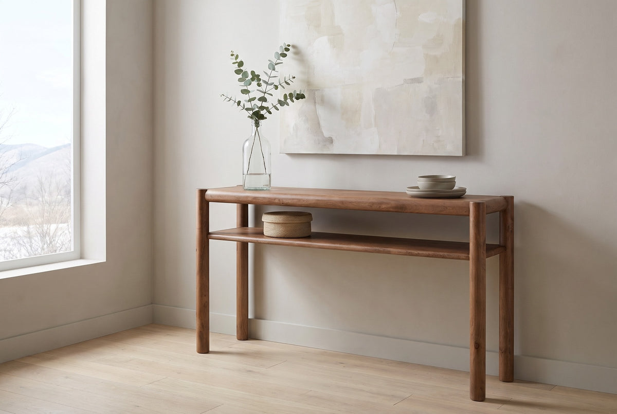 Corniglia console table in walnut against a pale plaster wall in a Calgary living room, the foothills through a large window