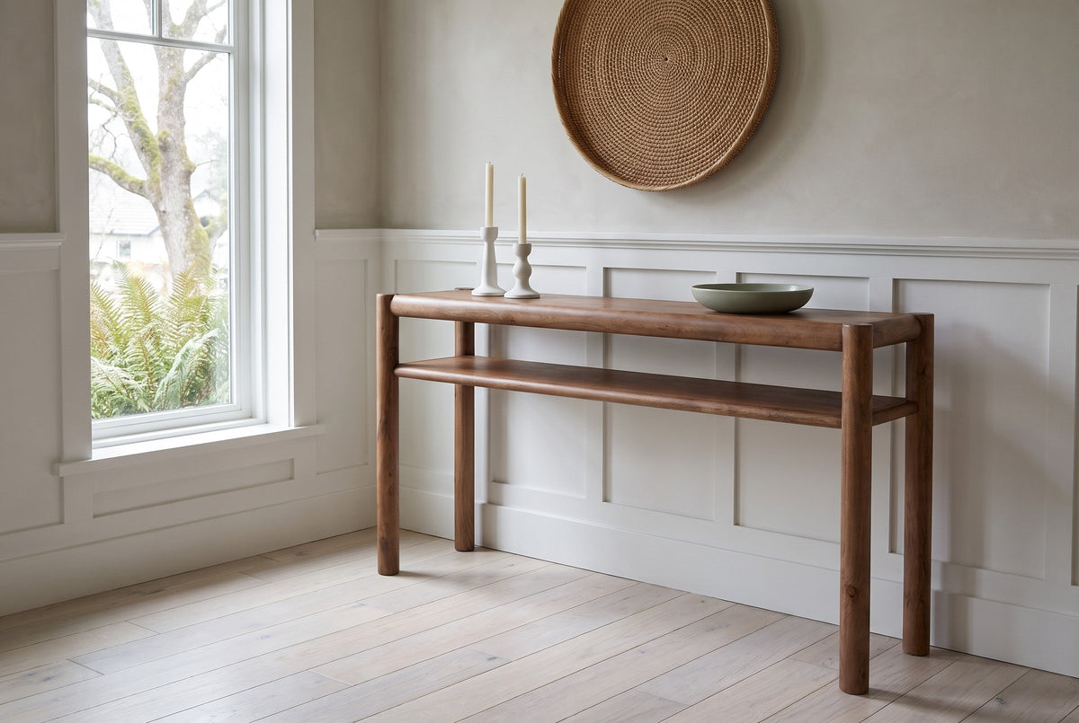 Corniglia console table in walnut against a putty-grey limewashed wall in a Victoria Craftsman entry hall, white candlesticks and a sage bowl on top