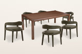 Corniglia 7-piece dining set, three-quarter view on a warm white studio backdrop: the walnut mango table with round legs and round rails and six moss faux leather armchairs