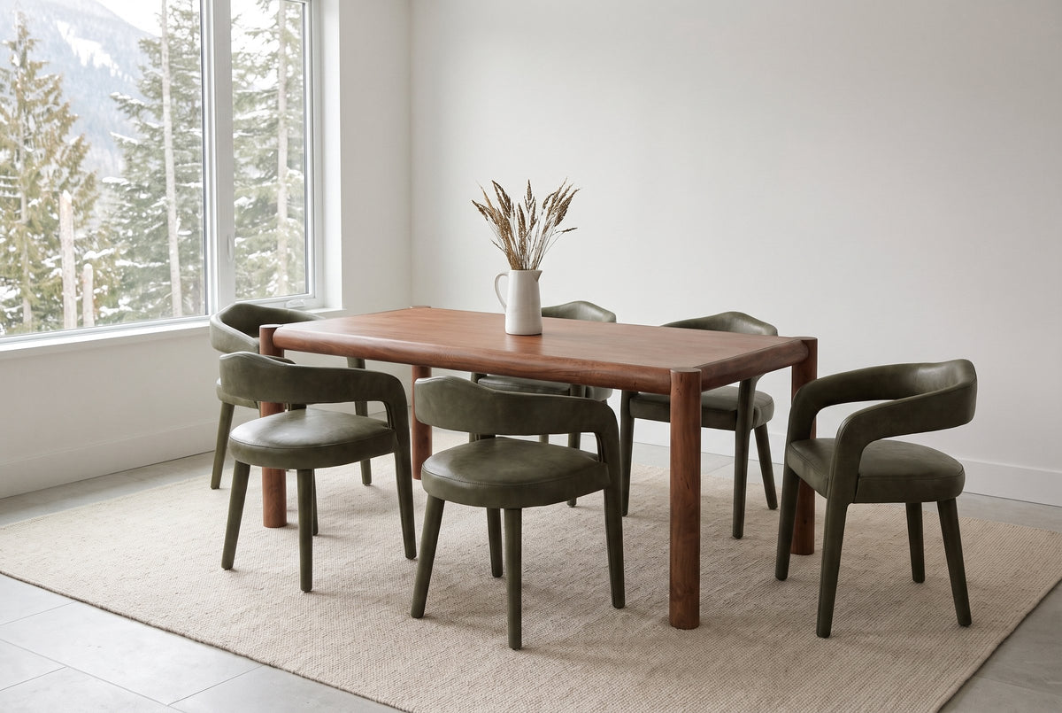Corniglia dining set in a Whistler mountain house on an oatmeal wool rug, cedars and a snowy slope through the wide window