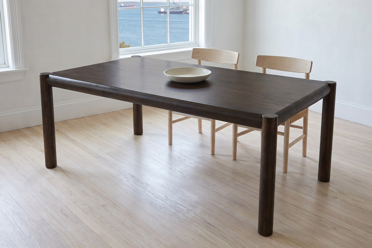 Corniglia dining table in mocha in a white Halifax dining room with a harbour view