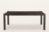 Corniglia dining table in mocha, long side: four round legs and a round rail frame around the top