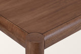 Close-up of a Corniglia corner in walnut: the round leg top flush with the surface