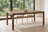 Corniglia dining table in walnut by a glass wall in a Vancouver dining room
