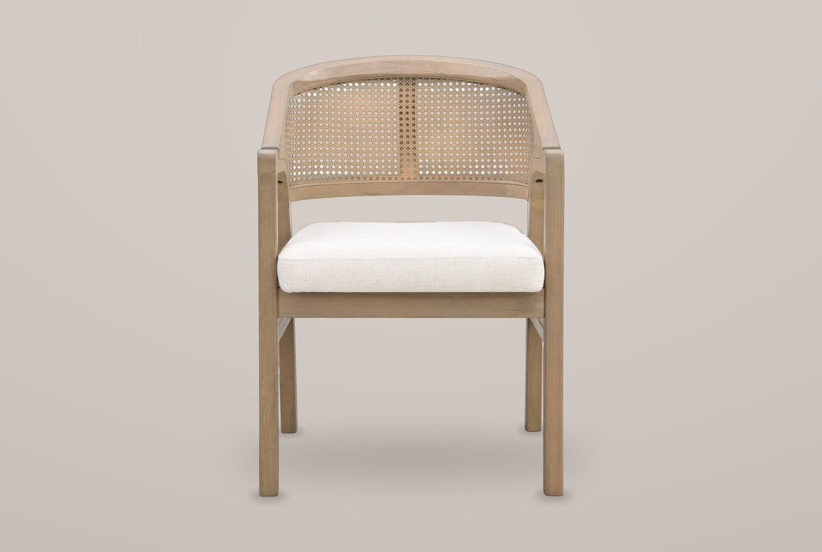 Cortina cane-back dining armchair in Light Ash, straight front view showing the woven cane back