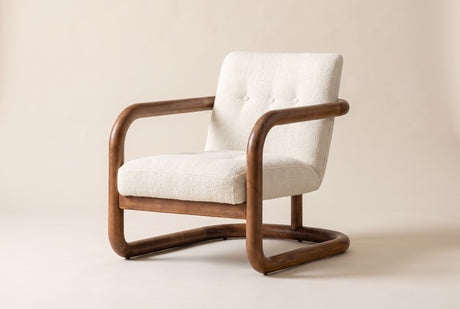 Corwin accent chair in Ivory, three-quarter view on a warm off-white studio backdrop: an ivory nubby weave inside the warm br