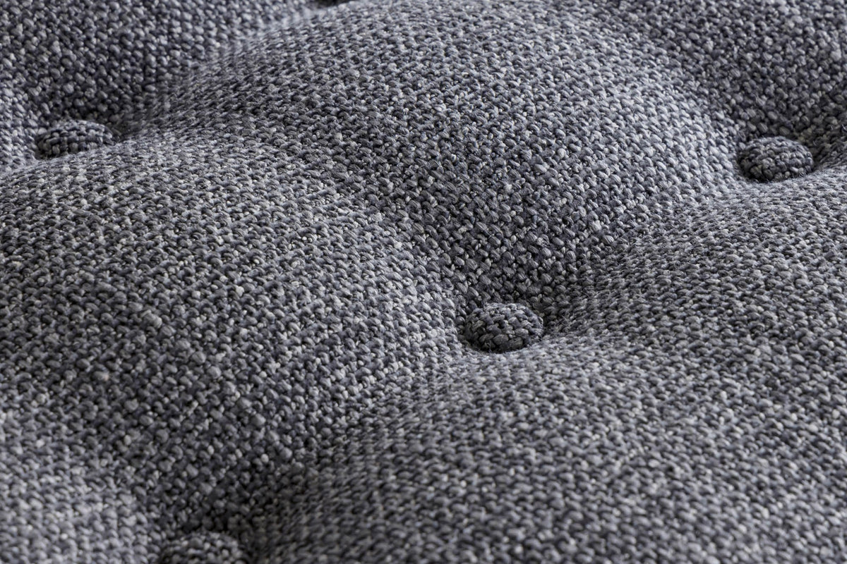 Button tufting on the Corwin Charcoal textured fabric