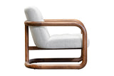Corwin accent chair in Ivory, side view of the tufted seat and wood frame