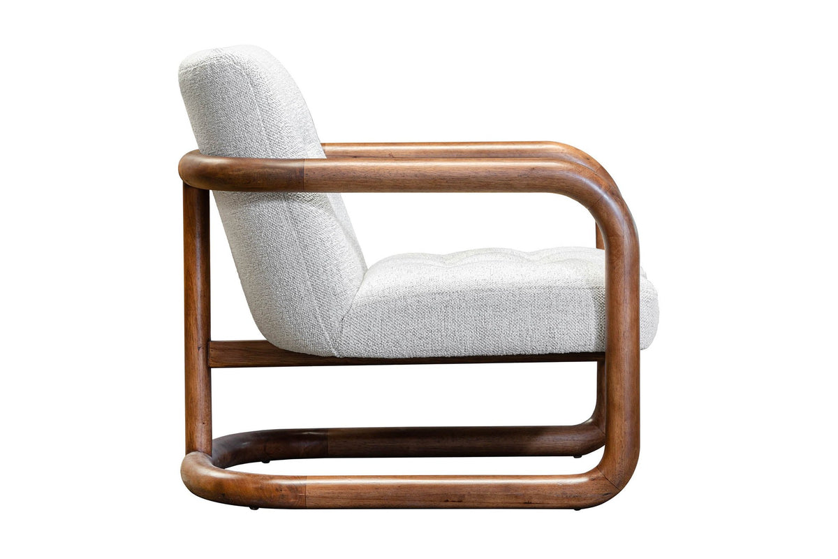 Corwin accent chair in Ivory, side view of the tufted seat and wood frame