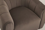 Close-up of the dark brown velvet seat with its stitched front seam, the channelled back and arms around it
