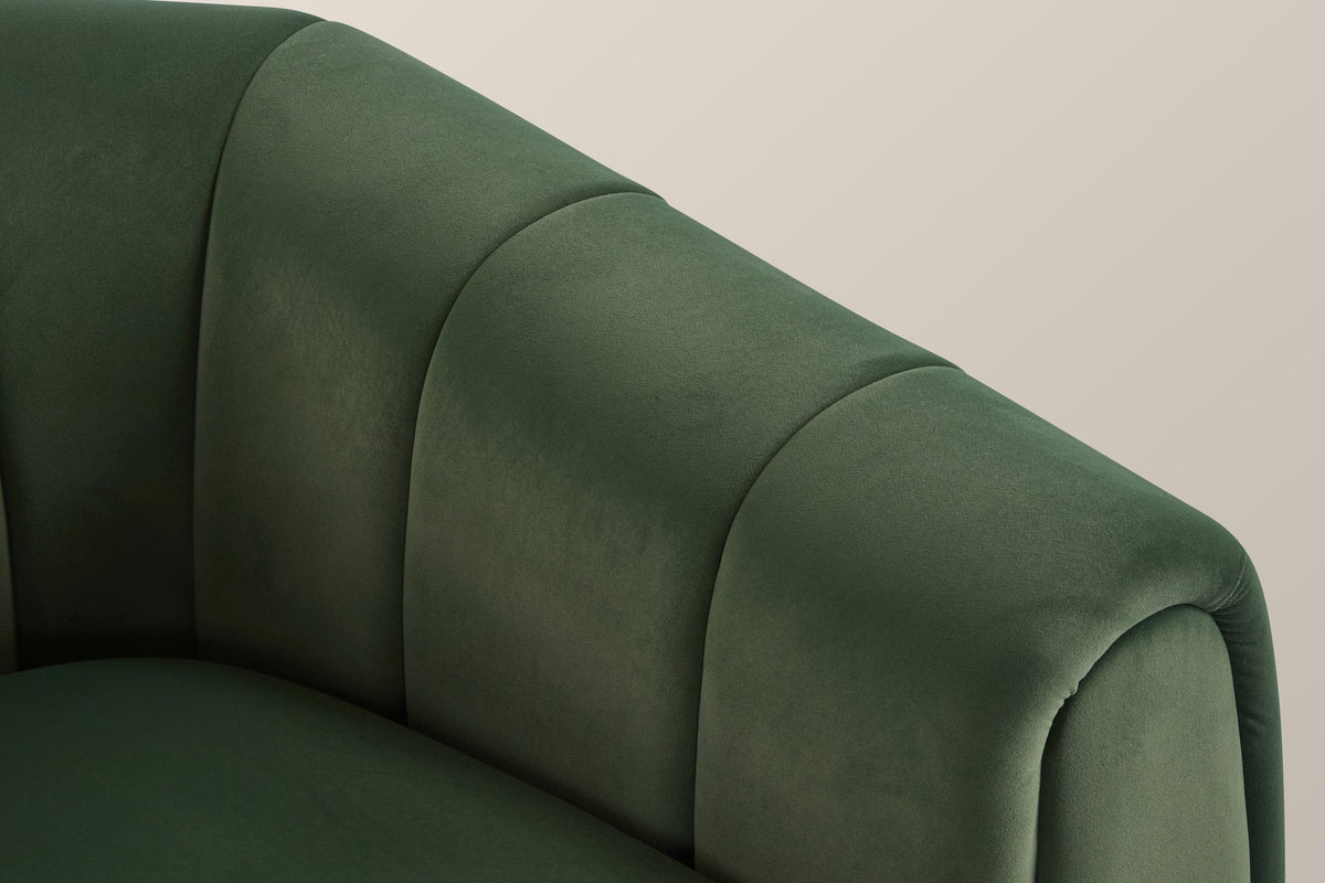 Close-up of a channelled velvet arm and its rolled front edge in olive green