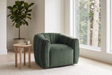 Cuneo swivel chair in olive green velvet beside a pale oak side table in a bright Vancouver living room