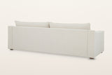 Back of the Cupramontana sofa in Beige on a warm white studio backdrop: a plain upholstered back panel with the back cushions
