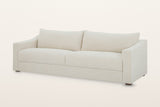 Cupramontana sofa in Beige, three-quarter view on a warm white studio backdrop: scooped arms with flat fronts