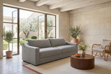 Cupramontana sofa in Grey seen from above at the front left in a Menerbes stone house, limestone walls, whitewashed beams