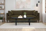 Darby Pine green woven fabric sofa in a bright living room with a black oval coffee table
