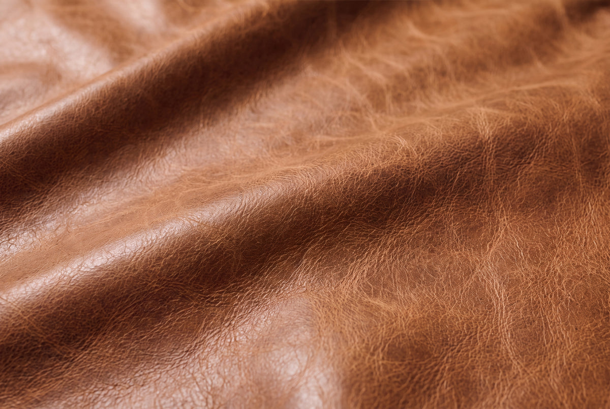 Close view of distressed leather and tailored stitching