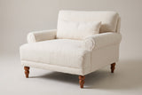 Dolceacqua oversized accent chair in ivory sherpa, three-quarter view on a warm grey studio backdrop