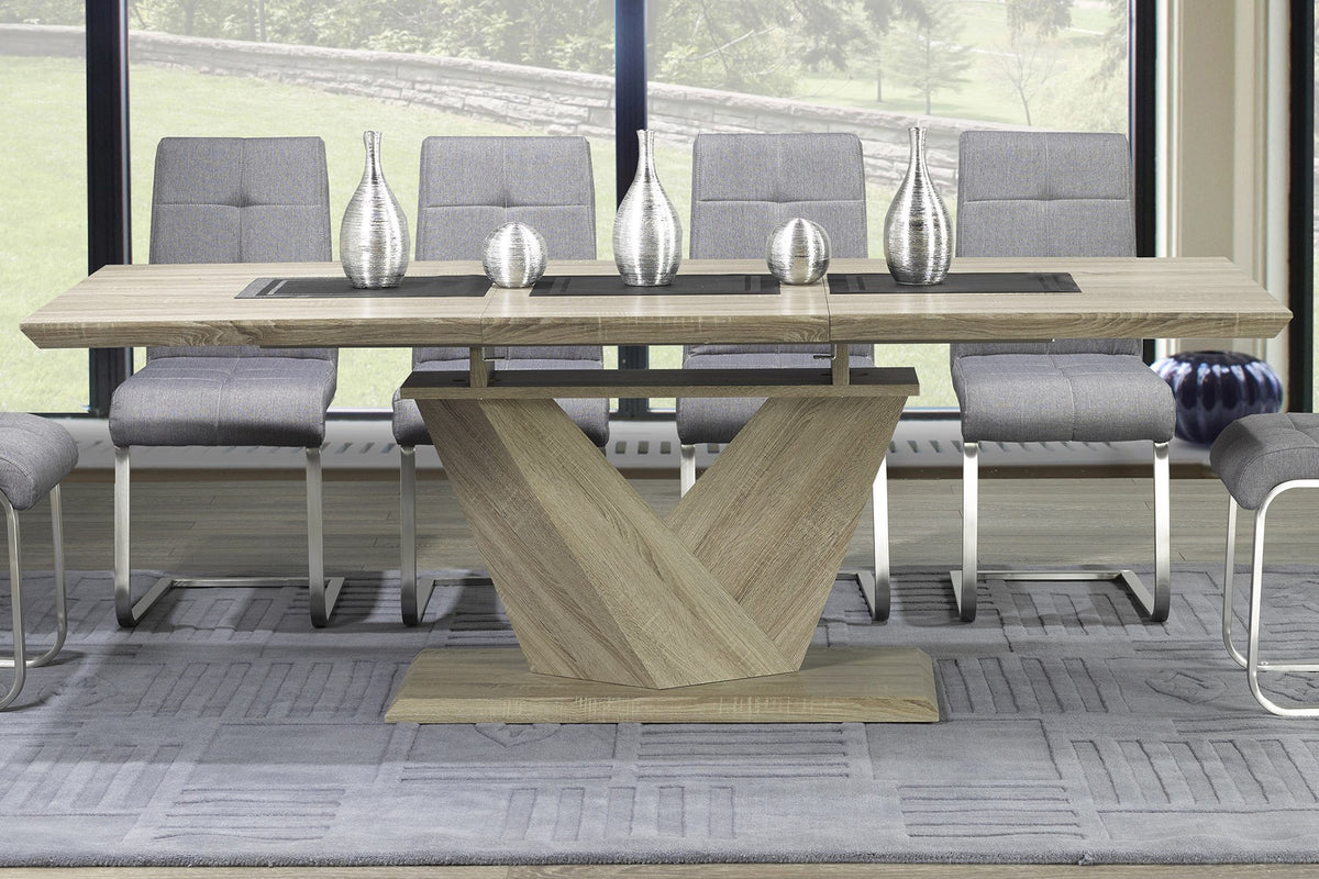 Ellis washed oak extension dining table set with vases in a dining room with tall windows
