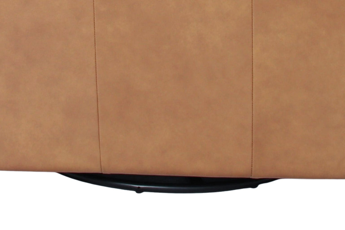Swivel glider base beneath the Elwood chair in Latte leather