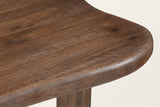 Close-up of the Erbusco top: the fully rounded edge of the solid mango top at its broad end, dark walnut finish