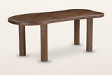 Erbusco freeform mango wood dining table in dark walnut, three-quarter view on a warm white studio backdrop