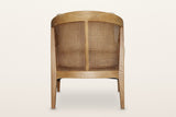 Esanatoglia accent chair from behind on a warm white studio backdrop: open cane with one centre splat under the ash band