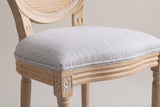 Close-up of the Este light grey woven seat, its fine welt, the grooved seat rail and a carved rosette corner